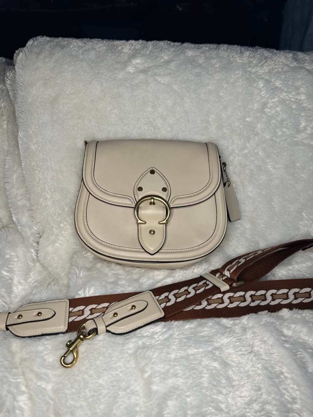 Coach Cream Crossbody Saddle Bag with Brown Patterned Strap
